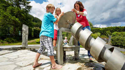 Family at the hydropower screw