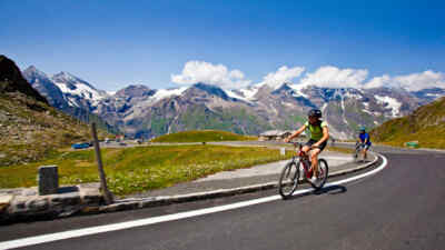 Cyclists in front of the mountains backdrop